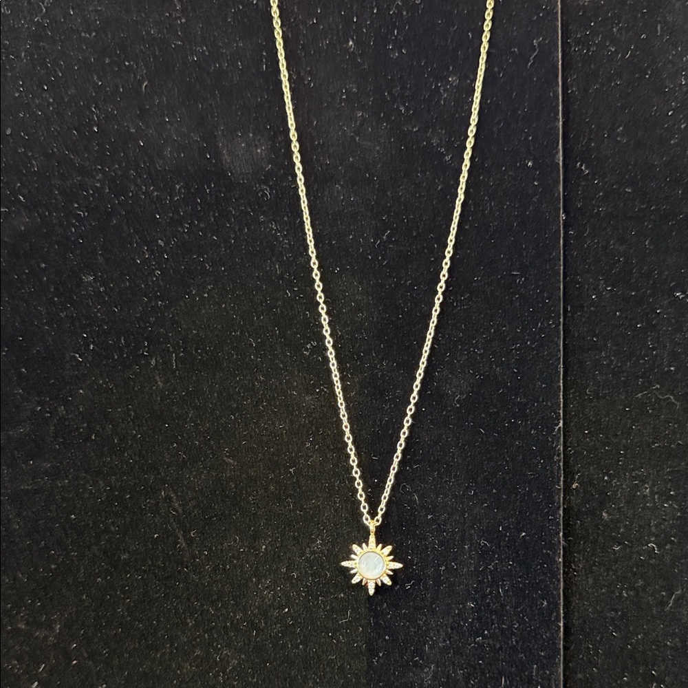 Gold Sunburst Necklace with White Center Stone